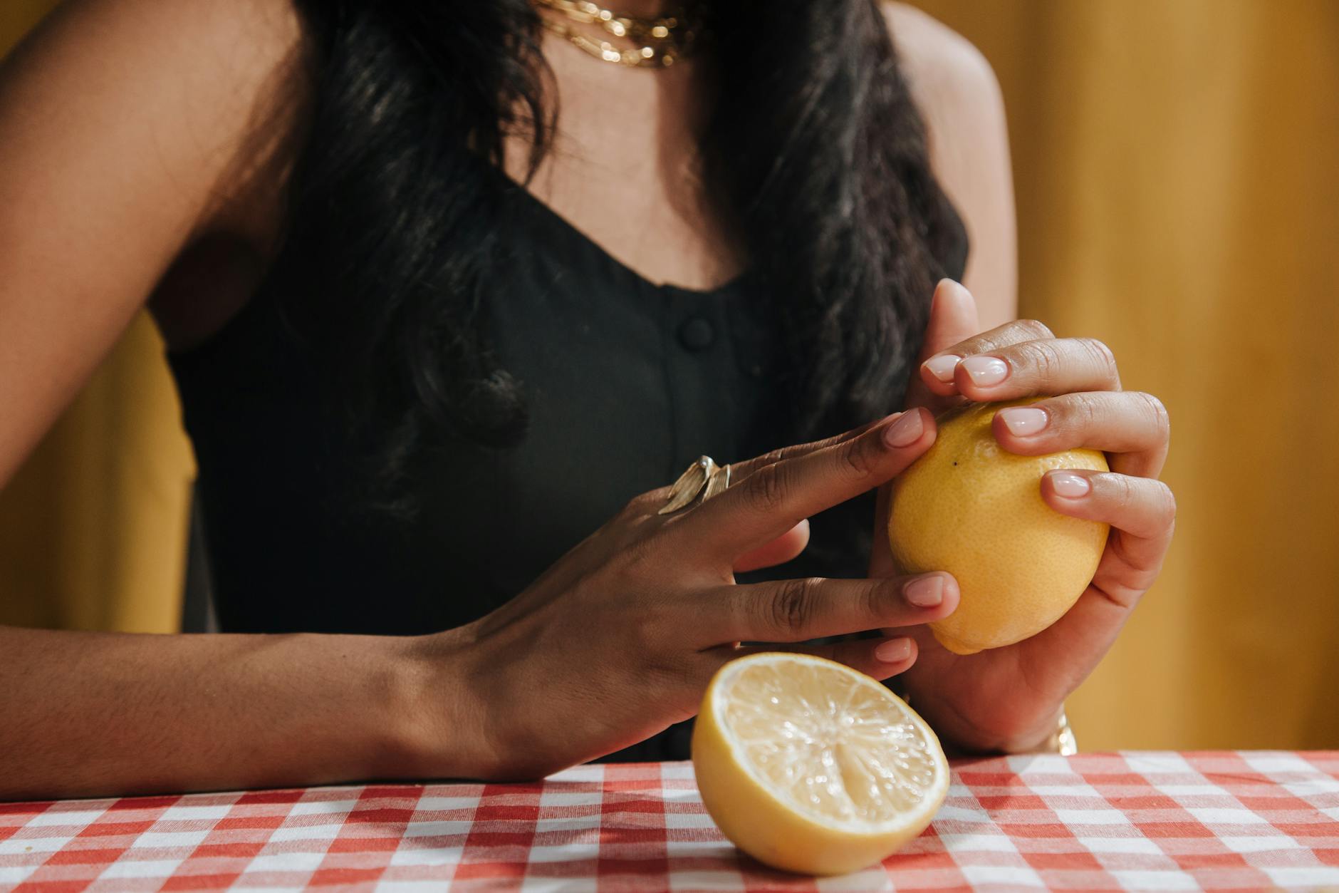 Woman holding a clitoral vibrator in a contemplative moment, exploring pleasure during recovery